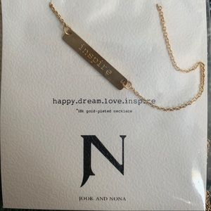 Necklace with name plate saying INSPIRE